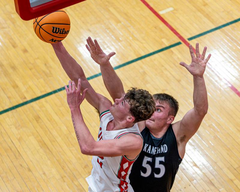 Regan Doerr (2) of LaSalle-Peru lays up ball whilst Kaneland's Jake Buckley (55) defends on Friday, Feb. 20, 2026 in Sellett Gymnasium at L-P High School.