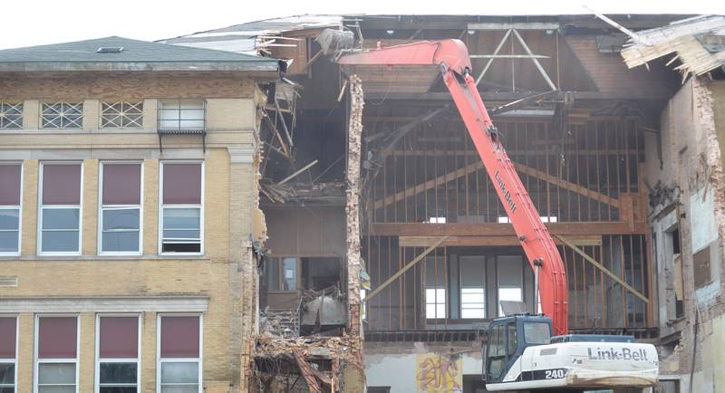 Workers from Fischer Excavating of Freeport demolish Congress School, 208 N. Congress Ave., on Tuesday, April 1, 2025 in Polo. Demolition of the 41,000 square foot school built in 1899, is expected to continue this week.