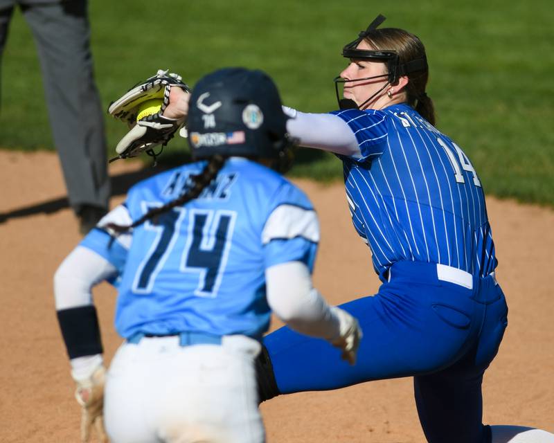 St. Charles North's Abby Zawadzki, right, receives the ball before Lake Park's Ava Arenz (74) arrives at second base for an out during the game on Wednesday April 24, 2024, held at Lake Park High School.