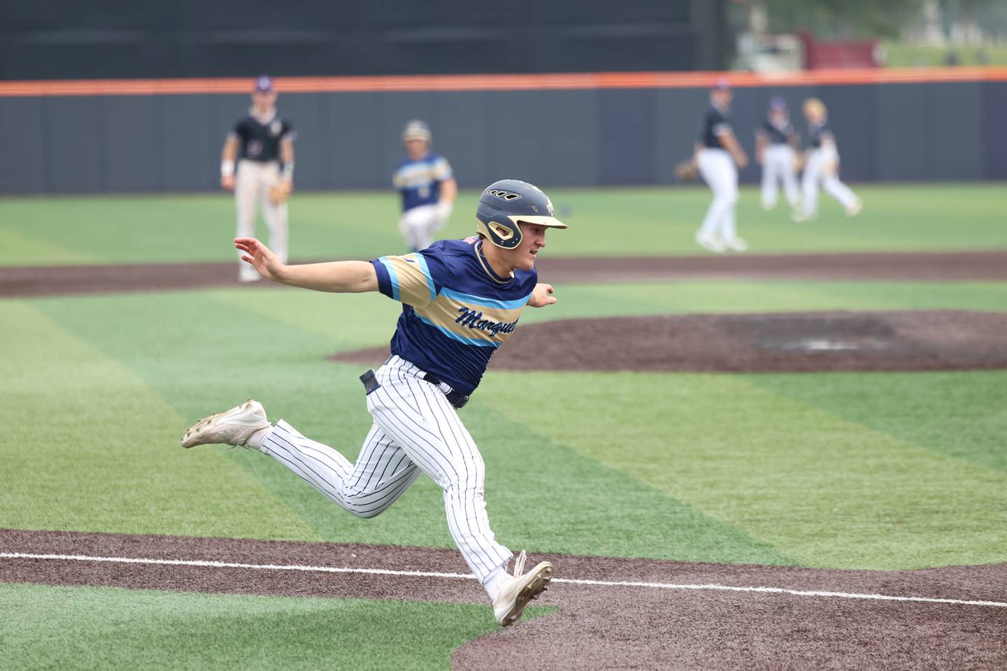 Ottawa Marquette’s Grant Dose cruises home to score during the Crusaders' 16-1 victory over Lexington in the IHSA Class 1A State semifinal on Friday, June 6, 2025.