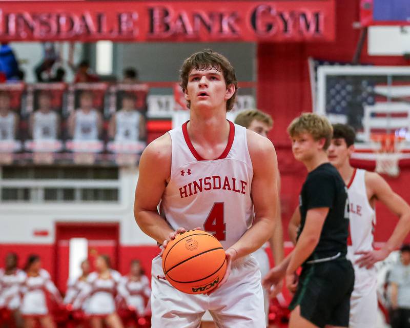 Hinsdale Central's Vince Buzelis (4) shoots a free throw during their basketball game between Glenbard West at Hinsdale Central, Friday  Dec 6, 2024  in Hinsdale.