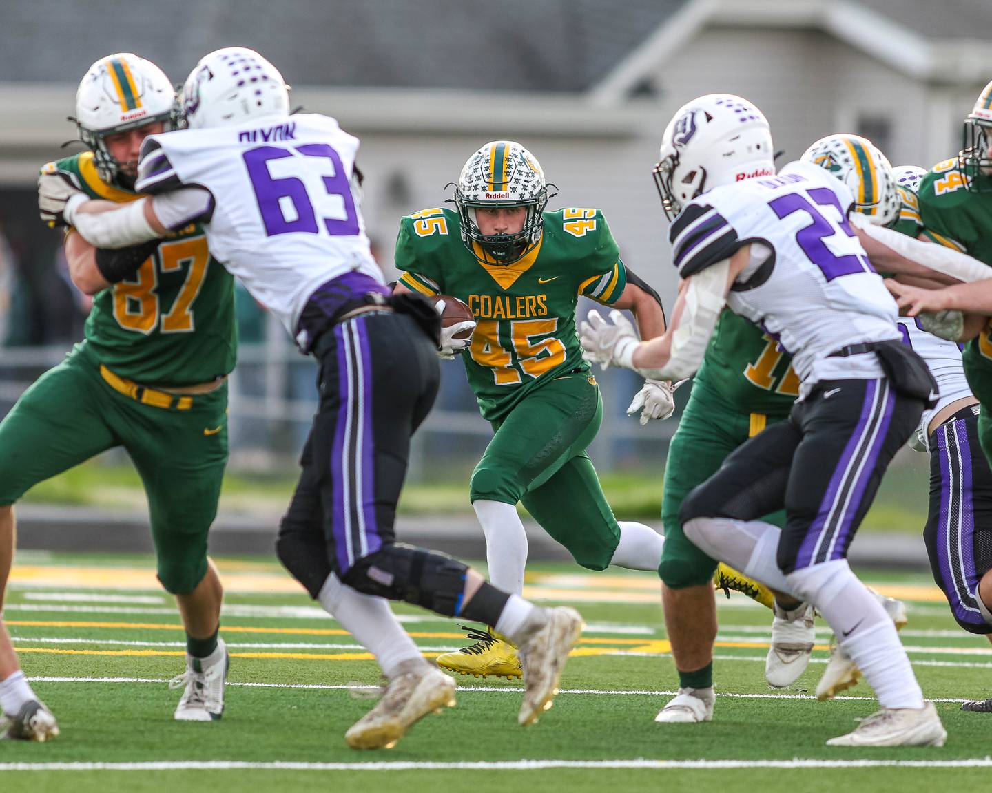 Coal City's Landin Benson (45) takes the snap from the wildcat formation during Class 4A quarterfinal football game between Dixon at Coal City on Saturday, Nov 16, 2024  in Coal City.