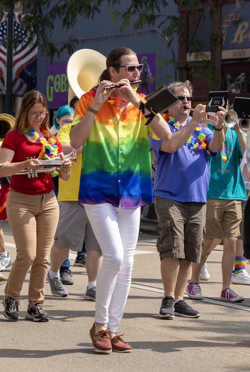 Tony Grunstad of Ottawa plays the flute as he marches with the Ottawa Pride Band during Saturday's pride parade through downtown Ottawa.