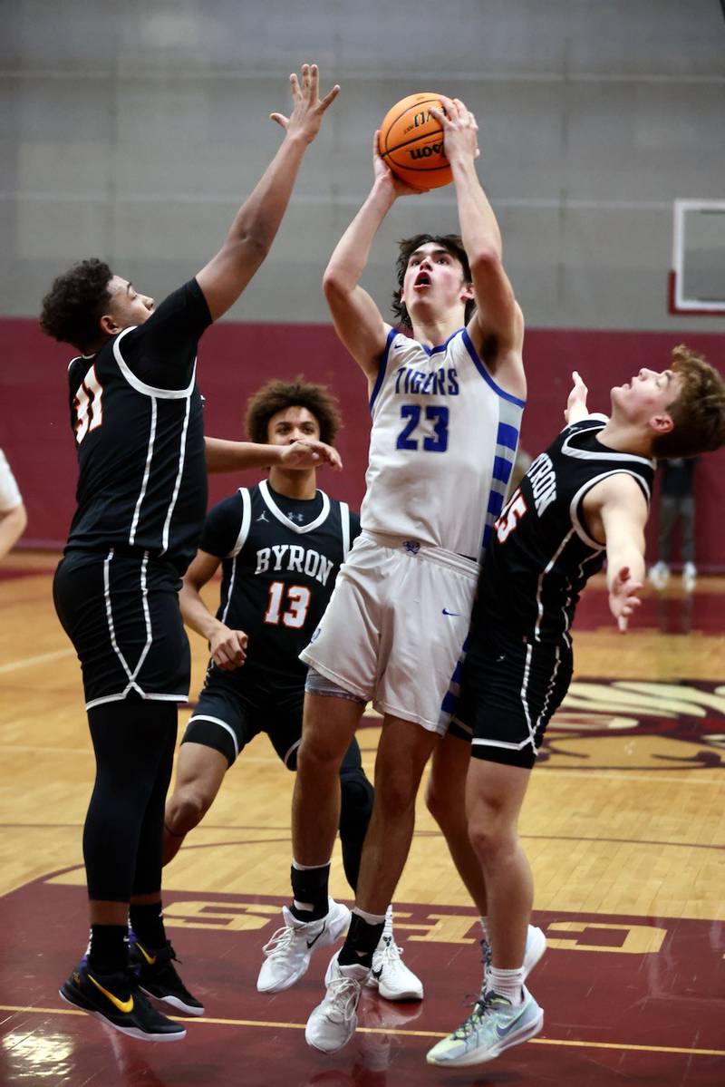 Princeton's Noah LaPorte shoots over Byron's Kaden McGough (left) and Ben Hively in Wednesday's sectional semifinals at Marengo. Princeton won 46-42 to advance to Friday's championship against Rock Falls.
