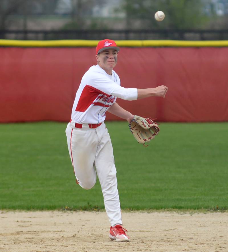 Oregon's Jackson Messenger throws to first for an out against Polo during a Saturday, April 27, 2024 game at Oregon High School.