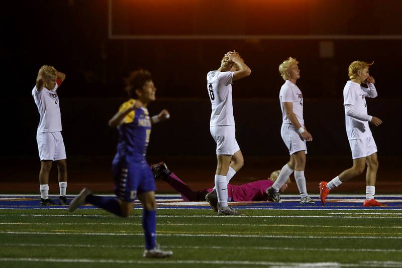 Prairie Ridge players react to a Chicago De La Salle goal during an IHSA Class 2A state semifinal soccer match on Friday, Nov. 8, 2024, at Hoffman Estates High School.