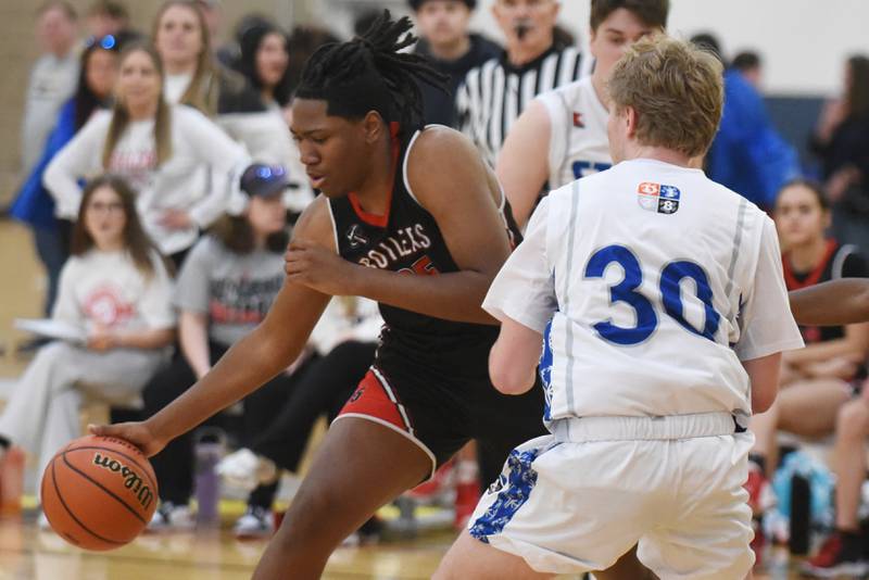 Bradley-Bourbonnais' Jeremiah Jones, left, drives to the basket as a Mt. Vernon player defends during the IHSA Special Olympics Unified Basketball Division 1 State championship at the University of Illinois Activities and Recreation Center Saturday, March 15, 2025.