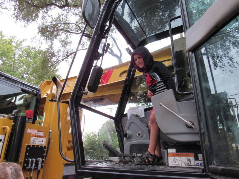 5-year-old Oakley tests out the bulldozer during the Coal City Fall Festival.