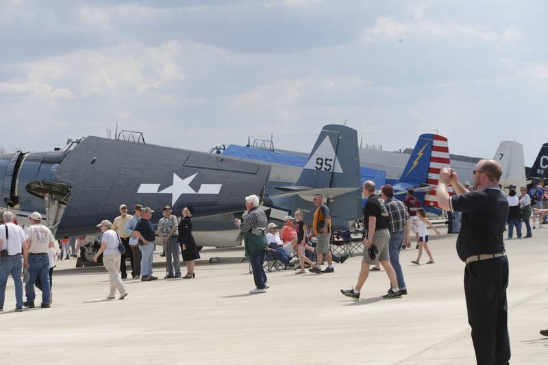 People gather around aircrafts during the first TBM Reunion on April 18, 2016 at the Illinois Valley Regional Airport in Peru. The TBM air show is the largest event at the airport and has grown into one of the biggest events in the Illinois Valley region.