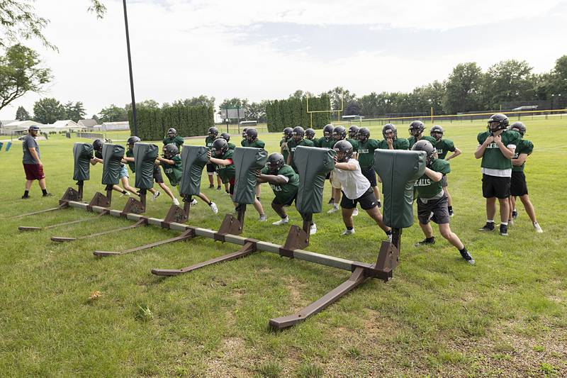 Rock Falls players run through drills Tuesday, July 16, 2024, during preseason football camp. Official practice will start in about a week.