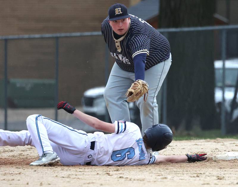 Hiawatha's Logan Brush tags out Parkview Christian Academy's Jordan Seaborg trying to get back to first Thursday, April 17, 2025, during their game at Hiawatha High School in Kirkland.