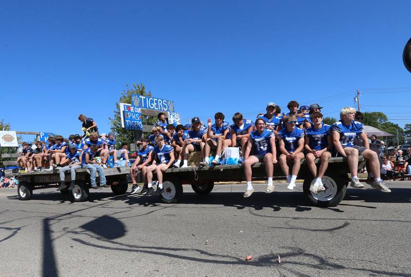 Members of the Princeton High School football team ride a float during the 52nd annual Homestead Festival parade on Saturday, Sept. 9, 2023 in Princeton.