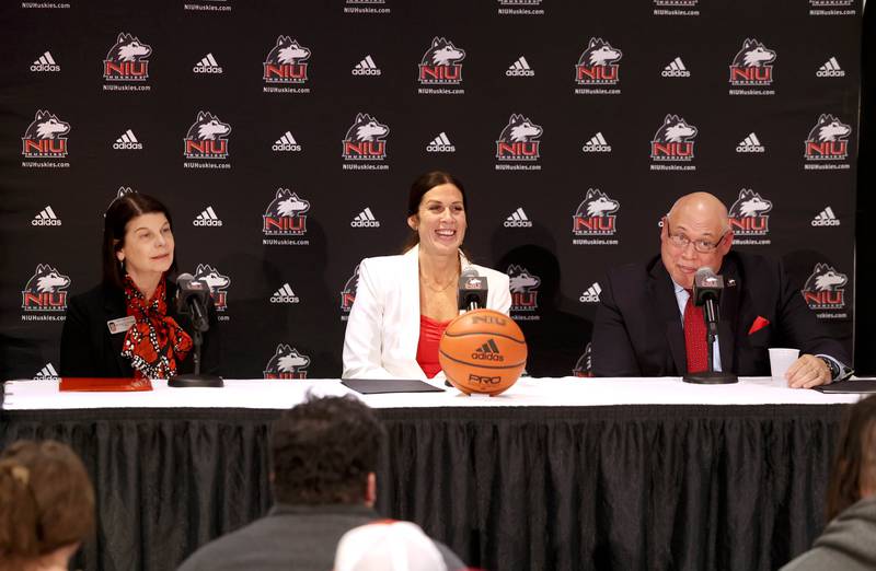 Lisa Freeman, (left) Northern Illinois University president, and Sean Frazier, vice president and director of athletics and recreation at NIU, introduce Jacey Brooks as the new NIU women’s basketball coach Wednesday, April 9, 2025, during a press conference in the Convocation Center at Northern Illinois University in DeKalb.
