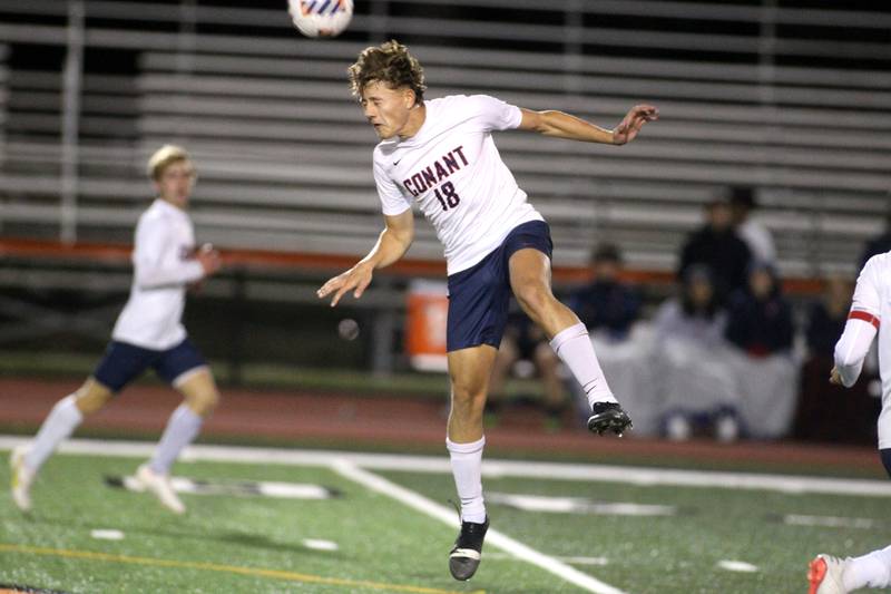 Conant’s Oliver Wozny heads the ball during a 3A St. Charles East Sectional semifinal against Glenbard East on Wednesday, Oct. 26, 2022.