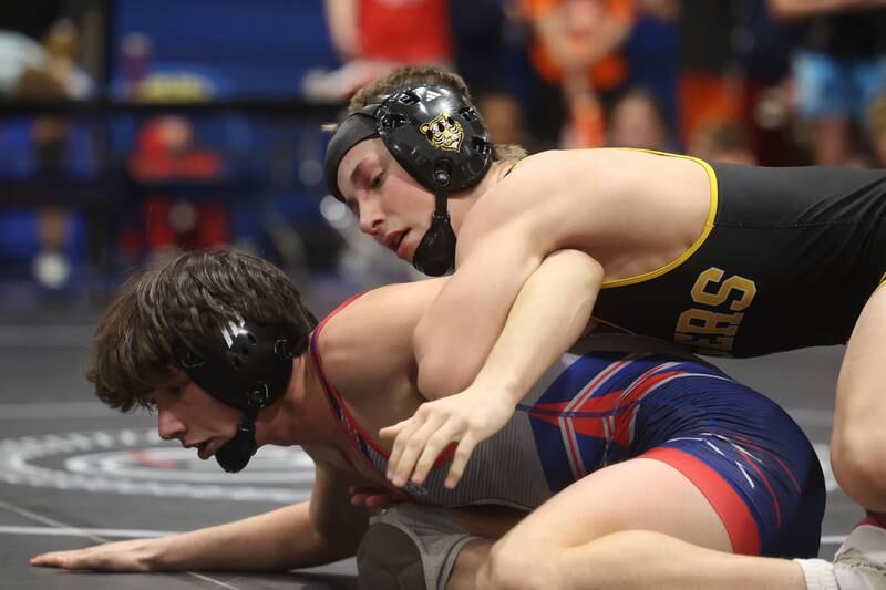 Joliet West’s Coehn Weber works over West Aurora’s Aiden Massaro in the Southwest Prairie Conference 126 pound Championship at Joliet Central on Saturday, Jan. 20th, 2024.