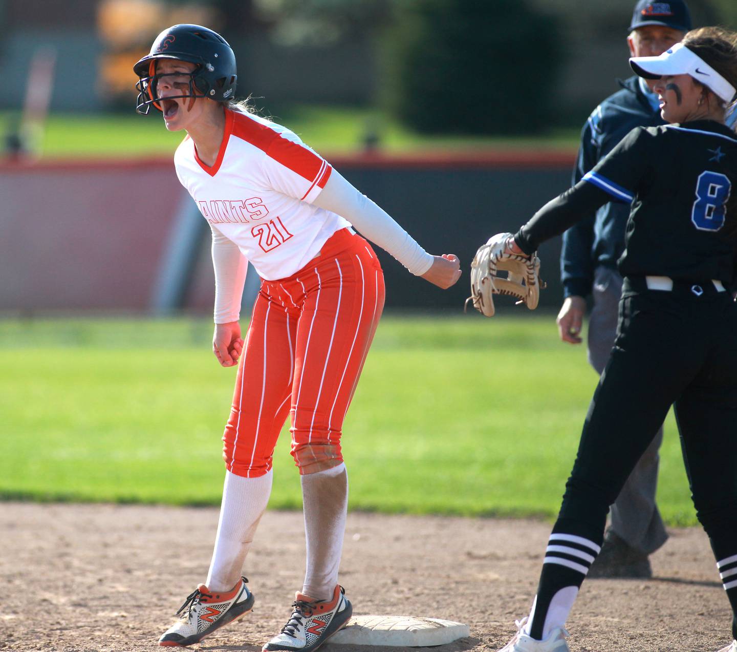 St. Charles East’s Hayden Sujack gets onto second base during a game against St. Charles North at St. Charles East on Friday, April 19, 2024.