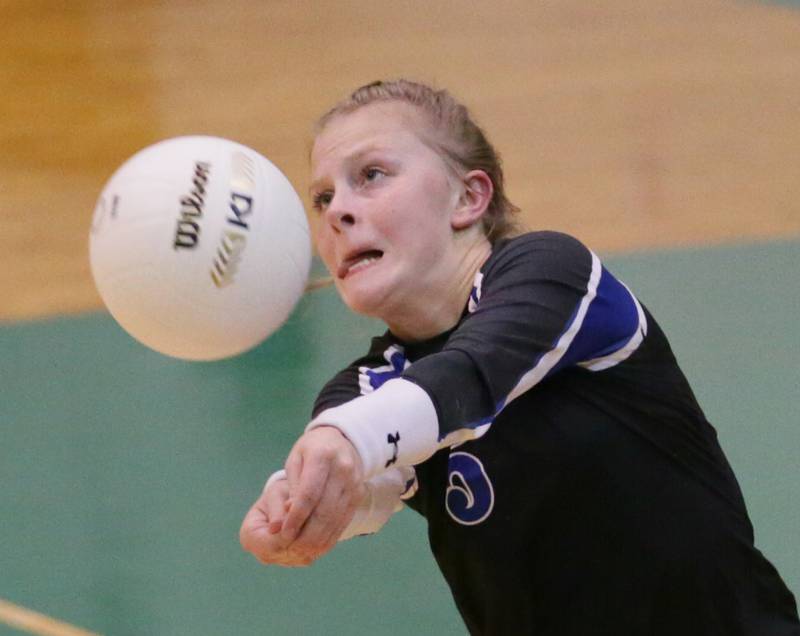 Newark's libero Taylor Kruser (5) returns a Putnam County serve in the Class 1A semifinal game on Wednesday, Oct. 16, 2022 at St. Bede Academy in Peru.