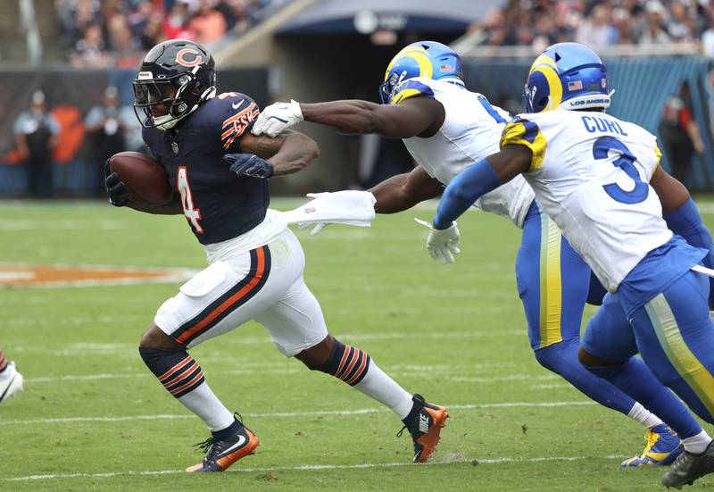 Chicago Bears running back D'Andre Swift avoids Los Angeles Rams linebacker Byron Young during their game Sunday, Sept. 29, 2024, at Soldier Field in Chicago.
