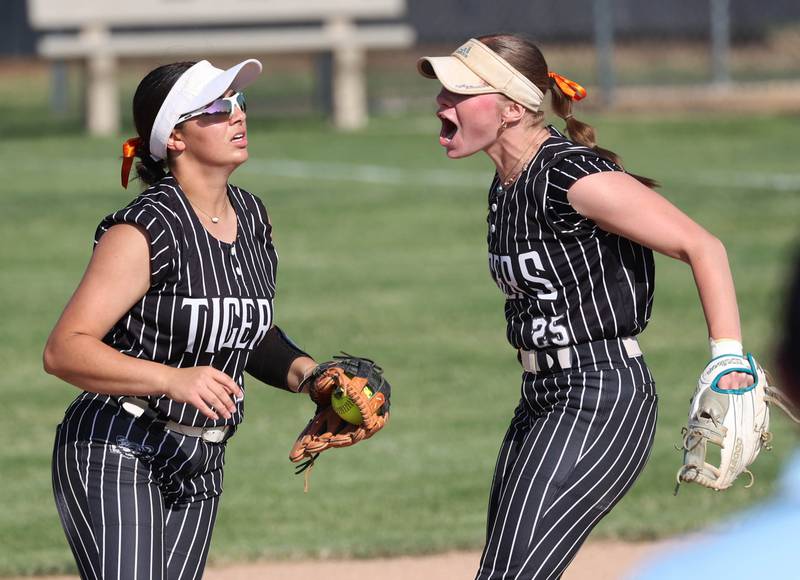 Crystal Lake Central's Adi Waliullah (left) is congratulated by teammate Kate Show after making a leaping catch Friday, June 6, 2025, during their Class 3A sectional final game against Prairie Ridge at Sycamore High School.