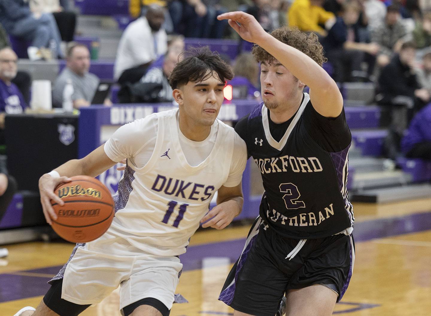 Dixon’s Wyatt Wetzell drives against Rockford Lutheran’s Blake Broege Friday, Jan. 20, 2023.