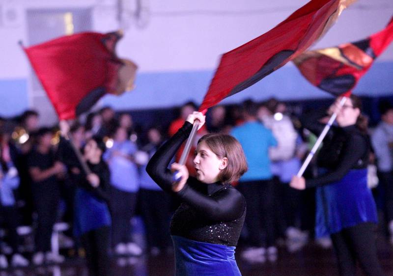 Members of the Nazareth Academy flag corps perform during a homecoming pep rally at the La Grange Park school on Friday, Sept. 29, 2023.