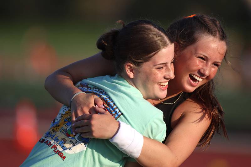 Crystal Lake Central’s Grace Fujino, right, reacts after qualifying for state in the pole vault in IHSA Class 3A Girls Sectional Track and Field Meet action at Red Raider Stadium on the campus of Huntley High School in Huntley on Wednesday, May 14, 2025.