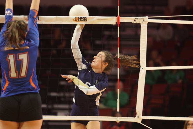 IC Catholic’s Kiely Kemph hits a shot against Genoa-Kingston in the Class 2A championship match on Saturday in Normal.