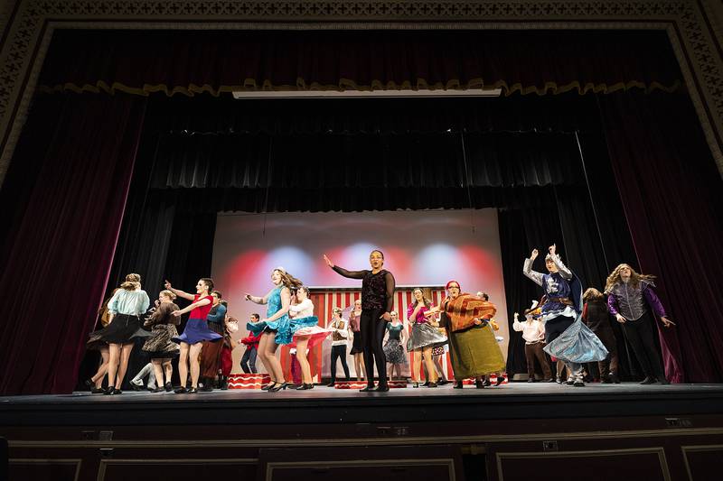 Cast members of Dixon High School’s “Pippin” rehearse the opening number Wednesday, April 17, 2024 in the Wiltz Auditorium at DHS. The show will open this Friday at 7pm.