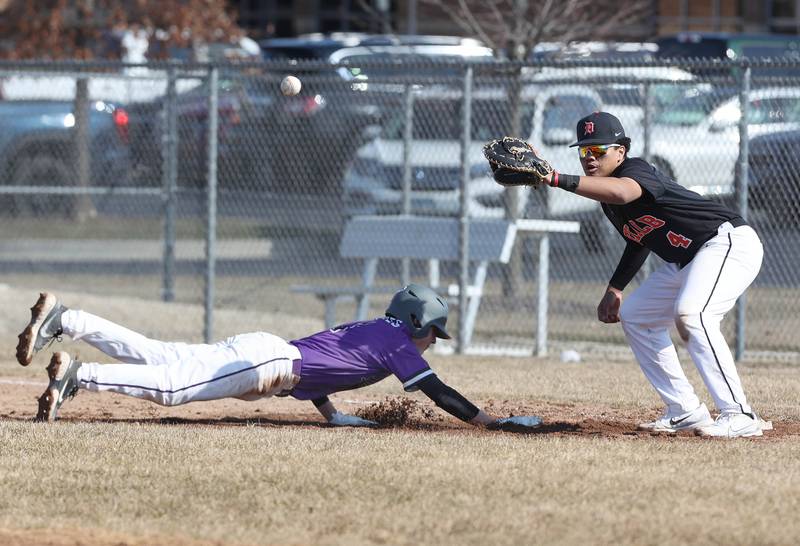 DeKalb’s Maddux Clarence takes the throw on a pickoff attempt as Dixon's Alex Harrison dives back safely during their game Tuesday, March 28, 2023, at DeKalb High School.