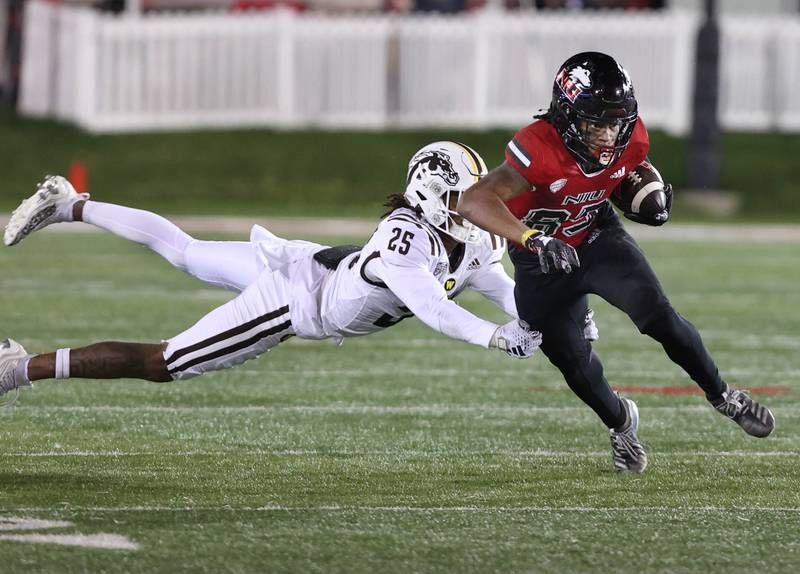 Northern Illinois' Trayvon Rudolph breaks away from Western Michigan's Aaron Wofford during their game Tuesday, Nov. 14, 2023, in Huskie Stadium at NIU in DeKalb.