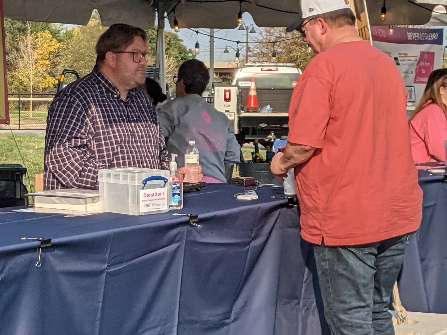 Oswego Village Trustee Kit Kuhrt helps out in the beverage tent at the Pouring For Pink: Breast Cancer Benefit Concert Oct. 12 in Oswego. Ten percent of net ticket and wine sales from Pouring for Pink will benefit three organizations – Waterford Place Cancer Resource Center in Aurora, The Edward Foundation and the American Cancer Society.
