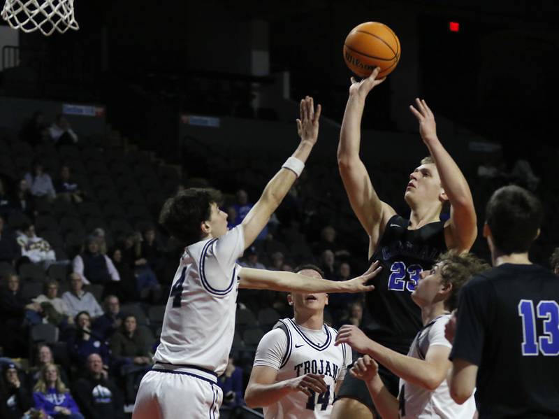 Burlington Central's Jacob Johnson shoots the ball over Cary-Grove's Dylan Dumele during a Fox Valley Conference basketball game  on Tuesday, Jan. 14, 2025, at Now Arena in Hoffman Estates.
