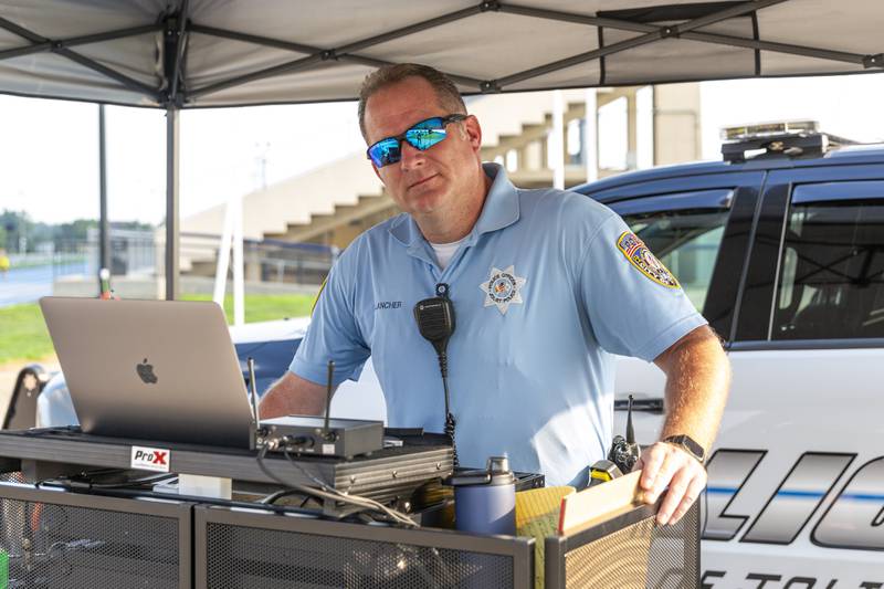 Officer Bob Klancher DJ's at the Joliet Police Department's National Night Out event Tuesday, Aug 5, 2025  in Joliet.