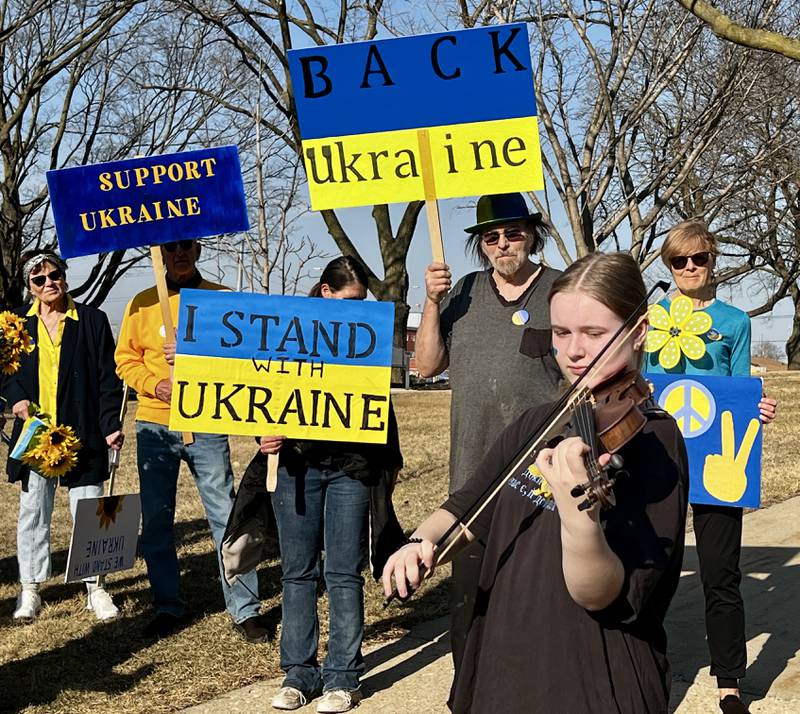 Ukrainian Anastasiia Pankiv plays her violin for the crowd during a Dixon vigil for Ukraine on March 13, 2025.