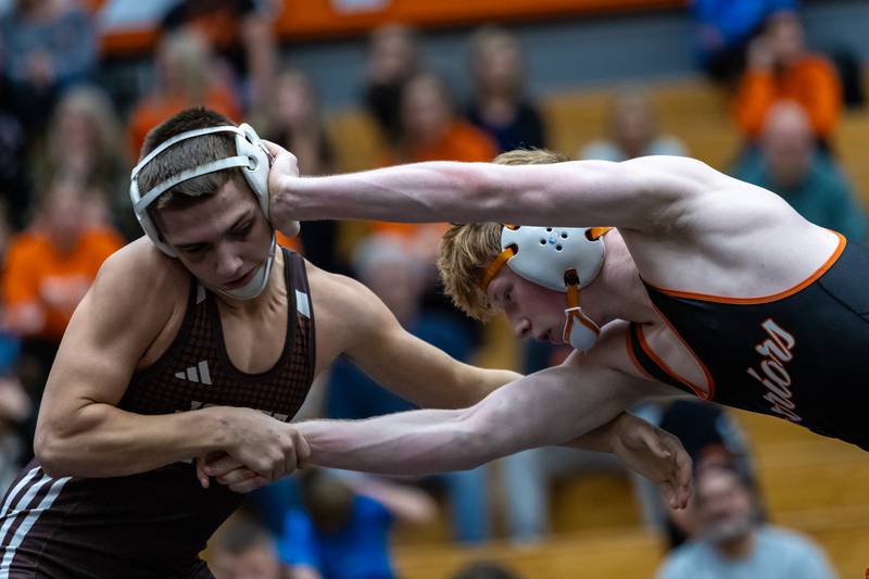 Joliet Catholic’s Matthew Laird and Lincoln-Way West’s Jack Strenzo compete in the 145 pound match at Lincoln-Way West on Jan. 8, 2026.