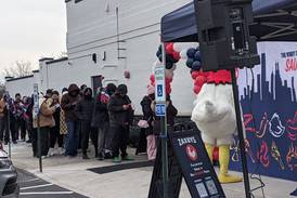 Customers line up in the cold at Zaxby’s in Plainfield for chance of free chicken