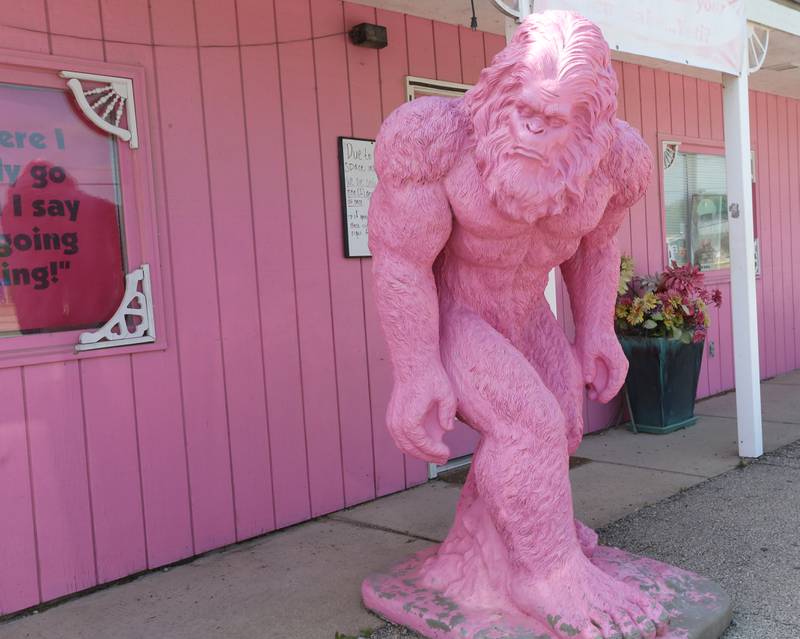 A large pink Yeti greets visitors in front of Two Girls and a Cupcake on Tuesday, May 9, 2023 in Utica.