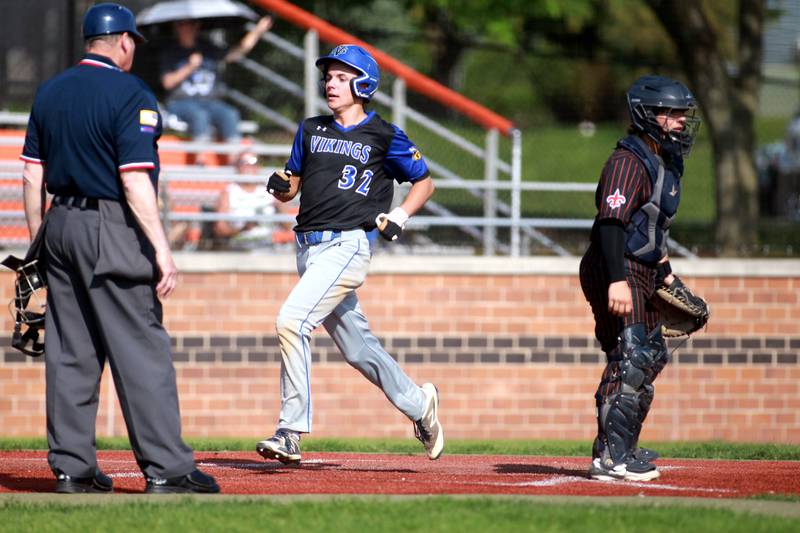 Geneva's Miles Dibble crosses home plate during a game against St. Charles East on Tuesday, May 13, 2024 in St. Charles.