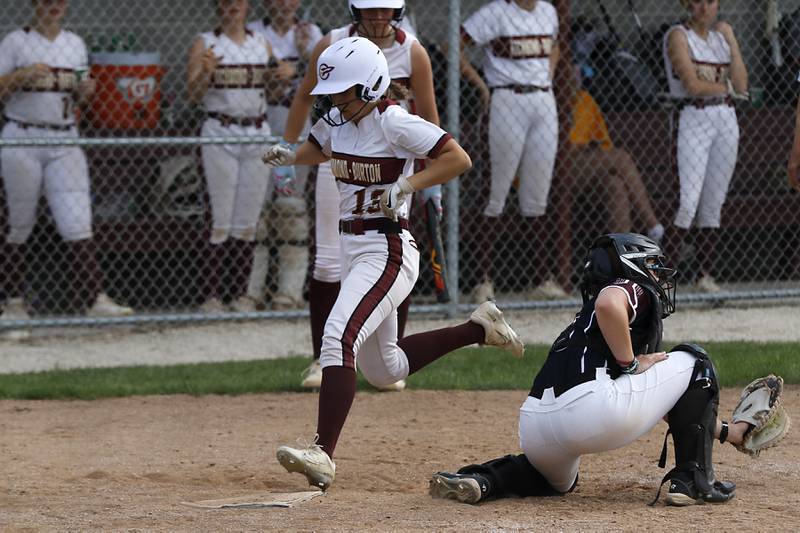 \Richmond-Burton's Ellie Smith scores a run in front of the throw to Marengo's Alyssa Pollnow during a Kishwaukee River Conference softball game on Monday, May 12, 2025, at Richmond-Burton High School in Richmond.