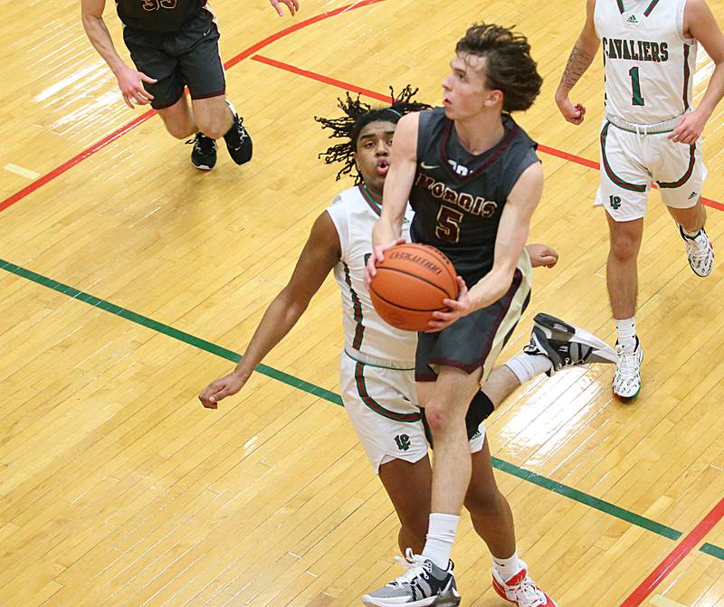 Morris's Caston Norris runs past L-P's Maalik Madgrigal to score on a layup in Sellett Gymnasium on Friday, Jan. 13, 2023 at L-P High School.