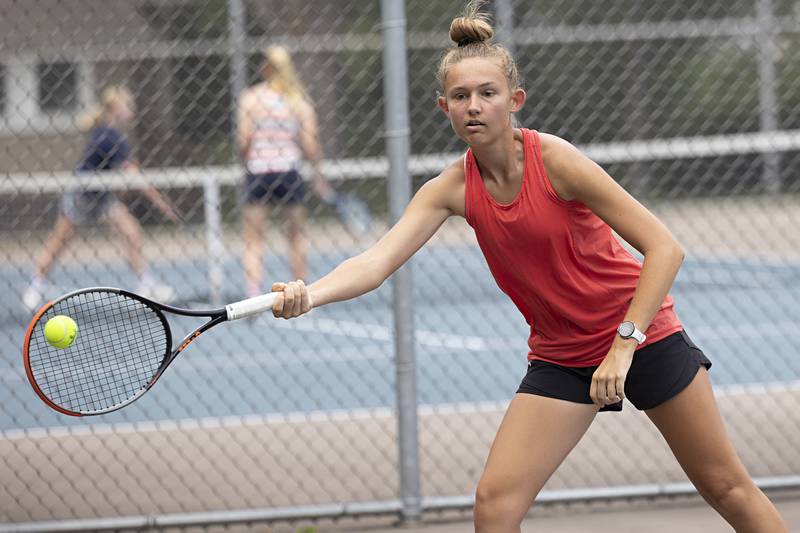 Grace Ferguson returns a shot during a doubles match Thursday, July 27, 2023 at the Emma Hubbs Tennis Classic in Dixon.