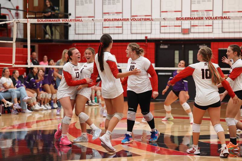 Bradley-Bourbonnais players celebrate earning a point over Manteno during the Panthers' victory in three sets, 25-21, 23-25, 25-17, over the Boilermakers on Monday, Sept. 15, 2025.