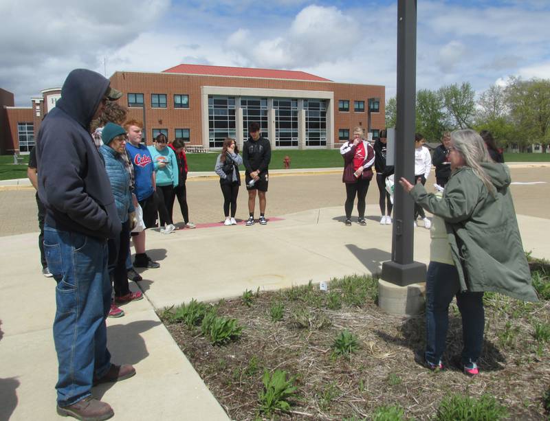 Master gardeners talk about Hall High School's conservation garden Saturday, April 22, 2023. The garden comprises 11 islands of native wildflowers that were planned and planted by students under the supervision of their teachers.