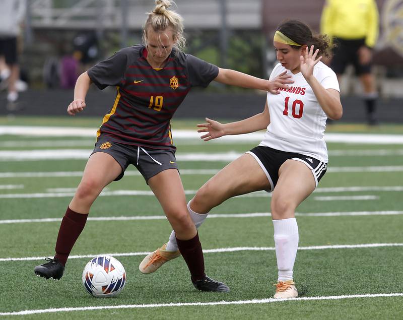 Richmond-Burton's Layne Frericks controls the ball in front of Woodlands Academy’s Giselle Vazquez during a IHSA Division 1 Richmond-Burton Sectional semifinal soccer match Tuesday, May 16, 2023, at Richmond-Burton High School.