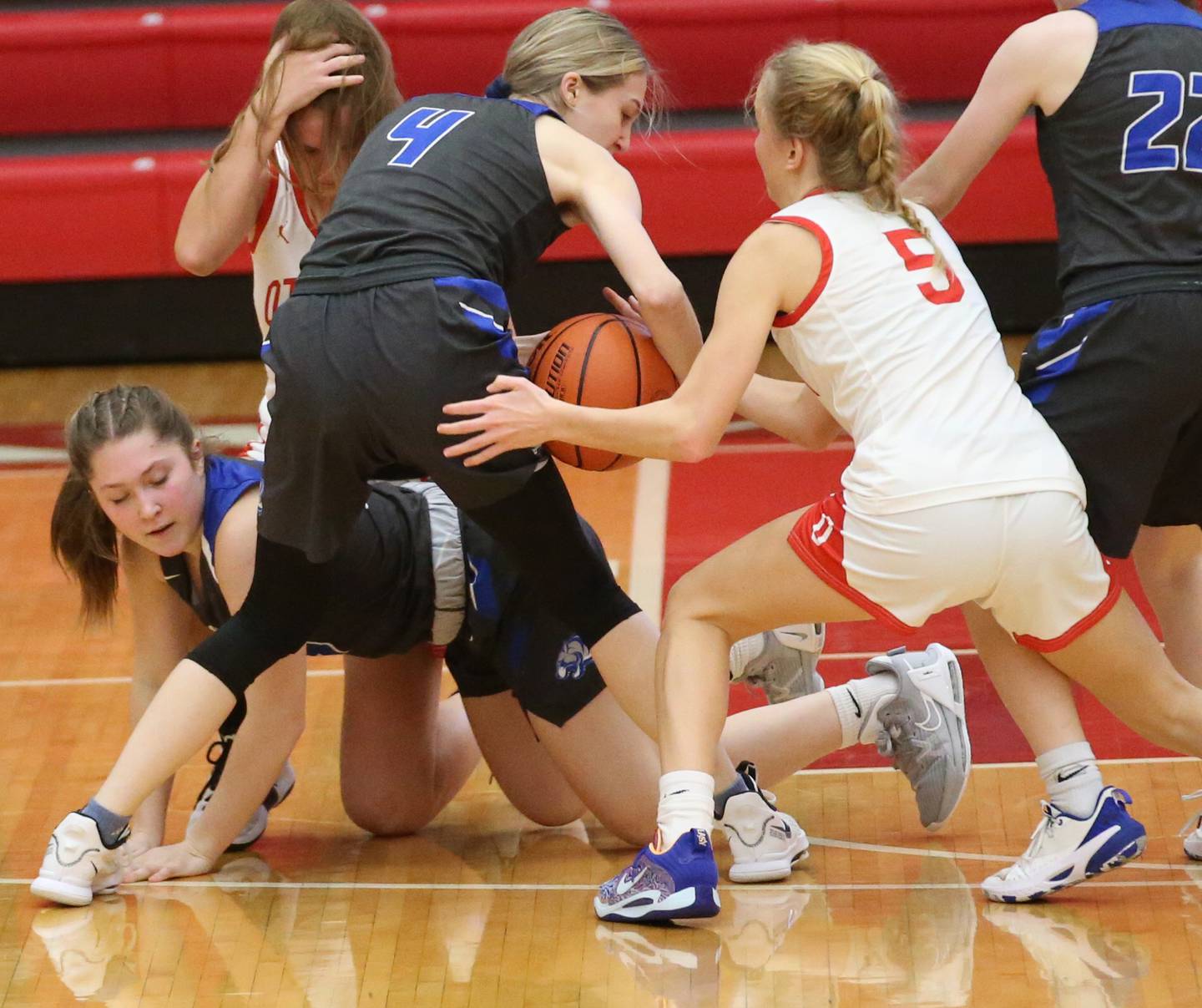 Princeton's Miyah Fox (left) looses the ball as her teammate Erin May (center) fails to pick it up as it falls into the hands of Ottawa's Grace Carroll (right) on Thursday, Dec. 15, 2022 at Kingman Gymnasium in Ottawa.