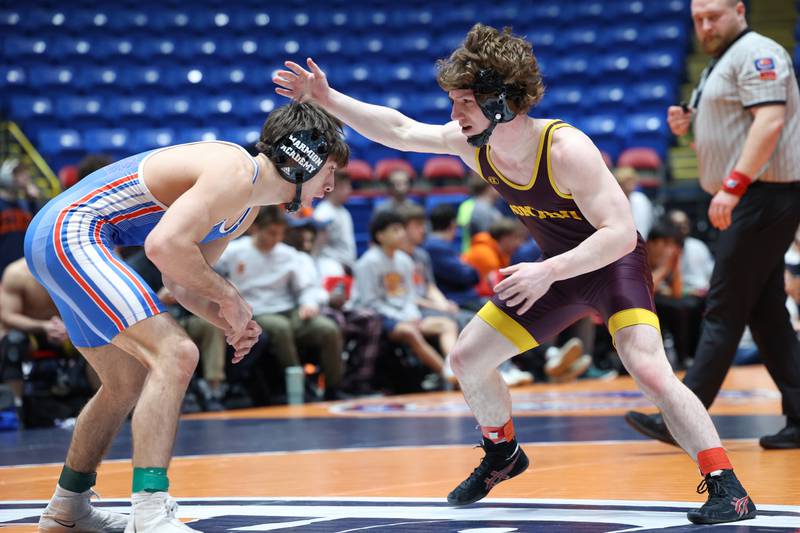 Marmion Academy's Demetrios Carrera, left, wrestles Montini's Jeremy Huf during Marmion Academy's victory over Montini in the IHSA Class 3A Dual Team State championship on Saturday, Feb. 28, 2026.