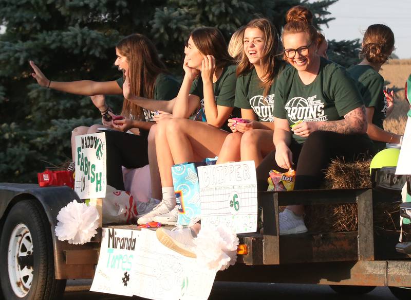 Members of the St. Bede volleyball team ride in the St. Bede Homecoming Parade on Friday, Sept. 29, 2023 at St. Bede Lane.