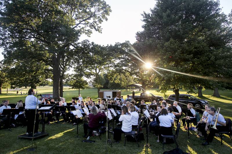 Marty Magnini conducts the Crystal Lake Community Band during a concert Tuesday, June 18, 2013, at Indian Oaks Park in Marengo.