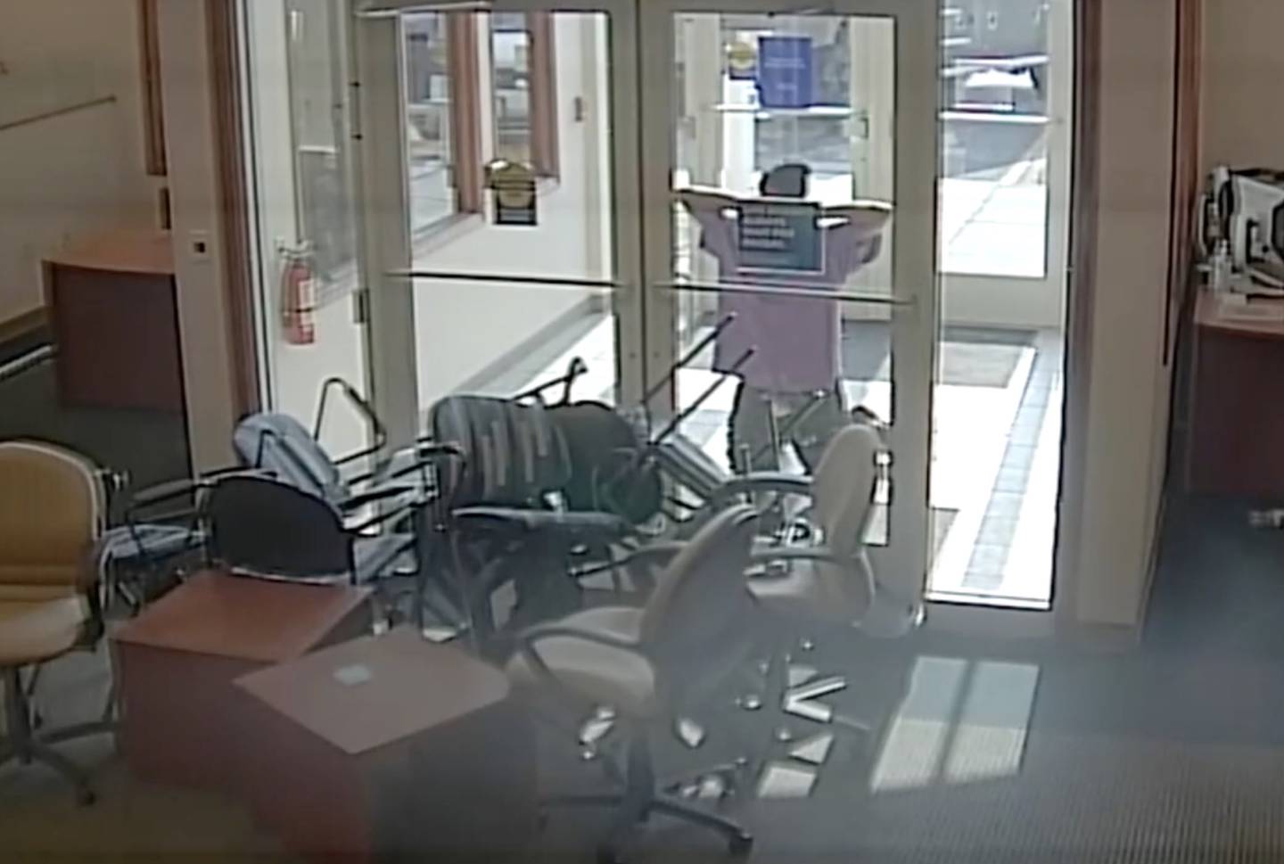 Gregory Walker, 65, of Crest Hill, surrendering after taking hostages at Fifth Third Bank on May 10, 2022, in Romeoville. Walker died after he was shot by Will County Sheriff's Lt. John Allen.