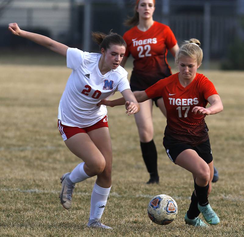 Marian Central's Adriana Wrzos battles with Crystal Lake Central's Olivia Andersonnfor control of the ball during a non-conference soccer match Monday, March 21, 2022, between Crystal Lake Central and Marian Central at Crystal Lake Central High School.